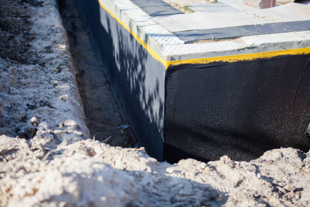 Professional Basement Waterproofing technician working in Mount Airy, GA